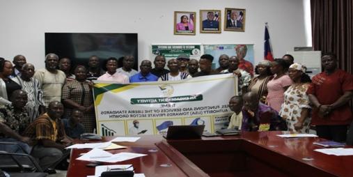 Participants pose for press