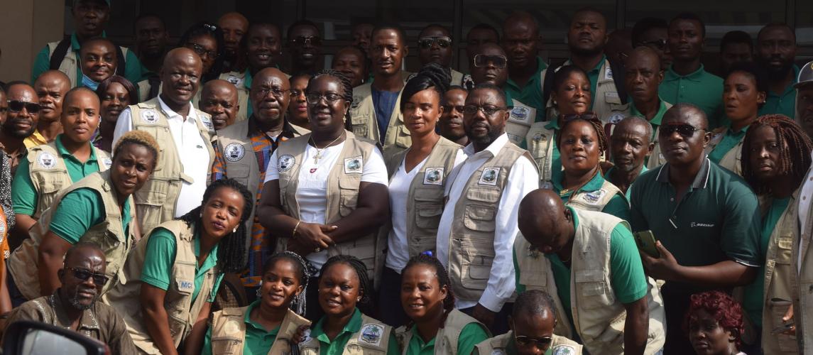 Minister Mawine G. Diggs with inspectors of the Minister of Commerce.