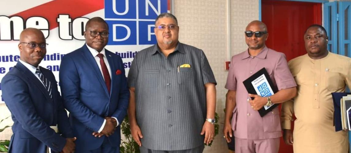 UNDP Acting Resident Representative Louis Kuukpen and Minister of Commerce & Industry Hon. Amin Modad unite at One UN House to fortify partnerships for sustainable development in Liberia.