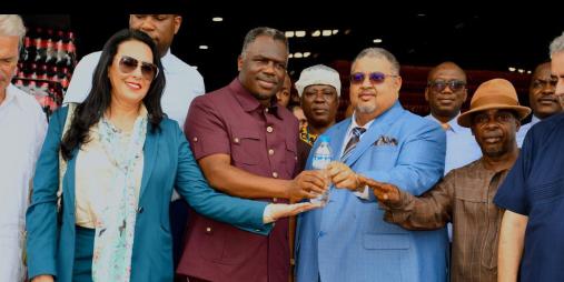 In the center of this group photo, Vice President of Liberia, Honorable Jeremiah Kpan Koung (left), is captured beside Minister Amin Modad (right), during the Aqualife Ribbon-Cutting.